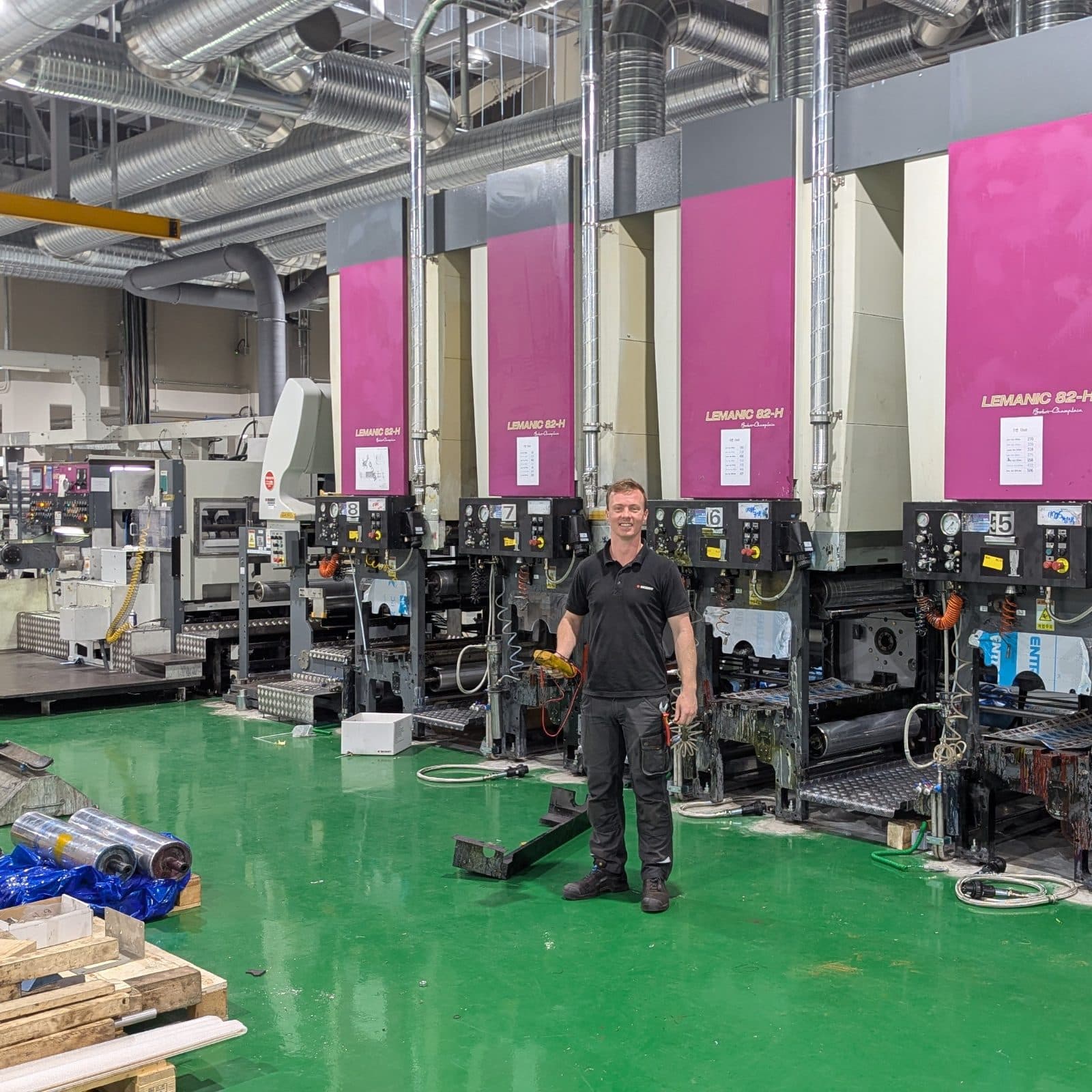 Technician in front of machine